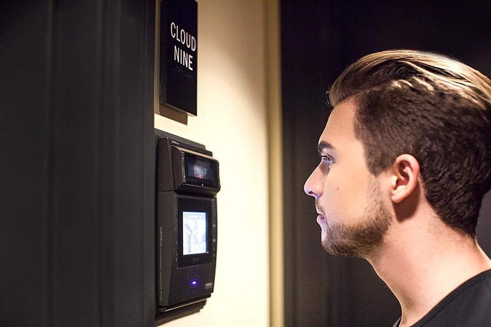 Man having his eye biometrically scanned